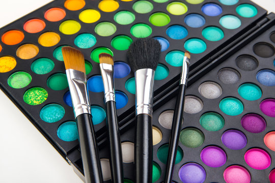 Different makeup brushes and make-up eye shadows