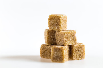 cane sugar cubes on a white background