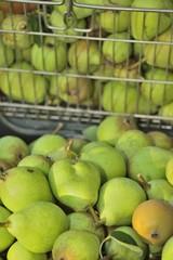 sale pears in basket on market