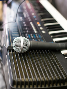 Microphone and electronic keyboard. Are isolated on a white back