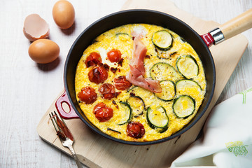 Omelet with vegetables and cheese. Frittata.