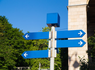 street sign showing cities, roads