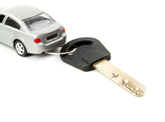 Toy car and key isolated on white background