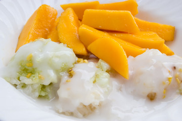 Sweet mango with sticky rice mix with coconut milk