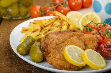 Big Chicken schnitzel with homemade chilli french fries