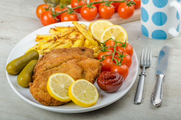 Big Chicken schnitzel with homemade chilli french fries