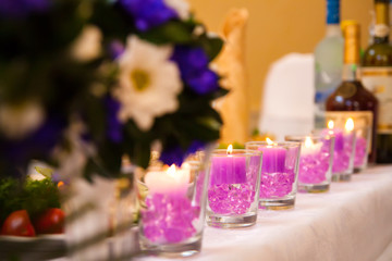 Romantic interior of a luxury restaurant with violet candlelight