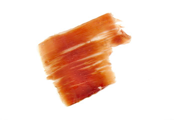 Spanish serrano ham slice isolated on white background.
