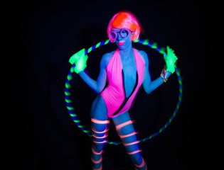 Fototapeta na wymiar sexy neon uv glow dancer with hulahoop