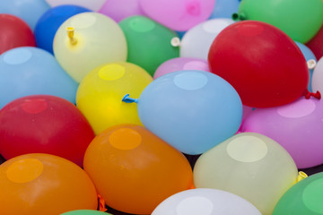 Fototapeta na wymiar colorful balloons containing water inside for game activity, abs