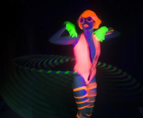 Fototapeta na wymiar sexy neon uv glow dancer with hulahoop
