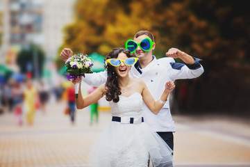 the couple having fun wearing glasses