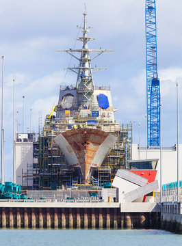 Destroyer Under Construction In A Naval Shipyard