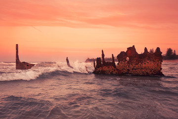 The S.S Dicky Shipwreck at Dicky Beach. Afternoon sunset .