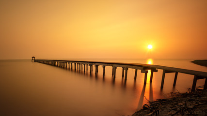 Wooded bridge at sunset