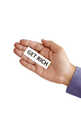 Hand Holding Paper With get Rich Text