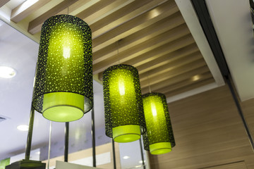 three green chandelier made by cloth hanging on decorative ceili