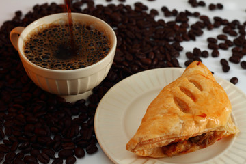 Coffee  and mushroom puff pastry.