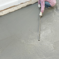plasterer concrete cement worker plastering flooring