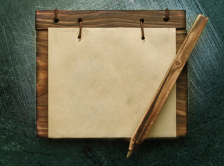 Blank paper notepad with wooden cover