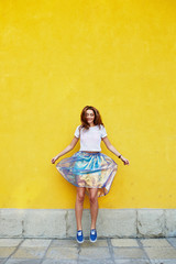 Attractive girl in an unusual skirt