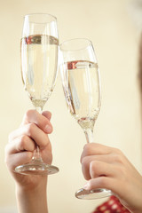 Glasses of champagne in female hands on a party