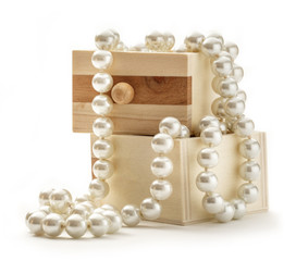 Wooden chest with white pearl necklace