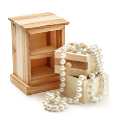 Wooden chest with white pearl necklace