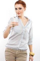 Happy young girl with a glass of water.