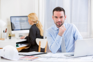 Fototapeta premium Young attractive engineer working at the office