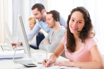 Young attractive woman working in a call center