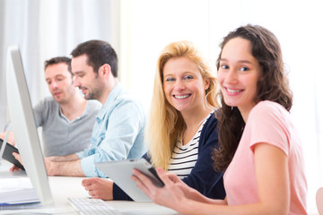 Fototapeta premium Young attractive people working together at the office