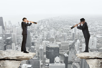 Businessman looks through a telescope