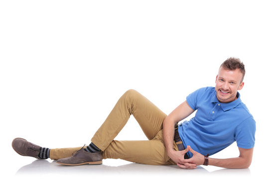 happy young man lying on the floor