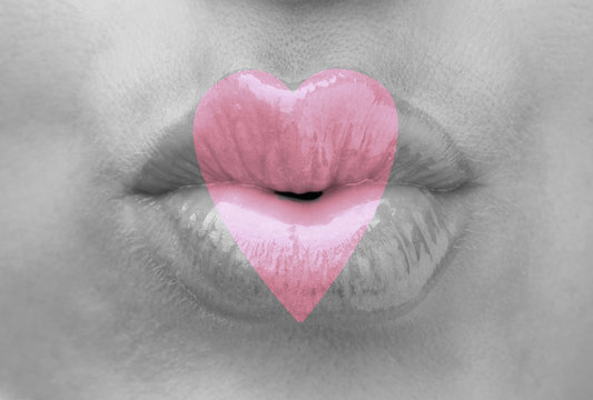 Love concept. Sexy lips with heart shape paint, closeup