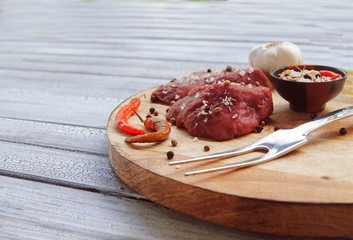 Raw beef with spices, pepper fried on an electric grill