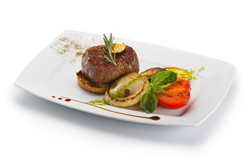 Plate with barbecue grilled beef steak meat with vegetables