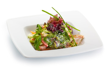 Spring salad with fresh vegetables in a white plate