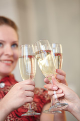 beautiful girls at a Christmas party with glasses of champagne