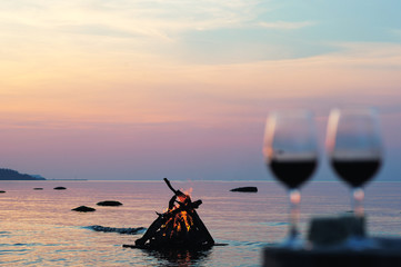 Campfire and wine glasses with wine