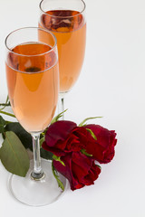 Rosé champagne flutes with roses