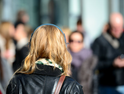 Blonde head in silhouette with headphones, Swedish woman