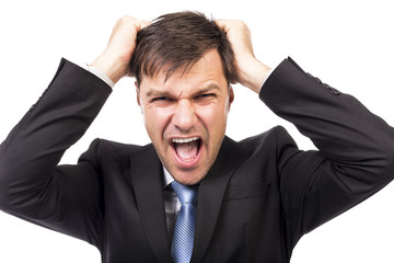 Closeup portrait of a frustrated businessman pulling his hair