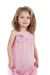 Portrait of an adorable little girl with pink dress standing