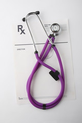 Closeup of a stethoscope on a rx blank, from above