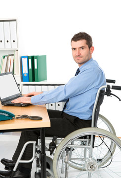 man in wheelchair is working
