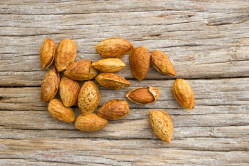 Roasted almonds on wood