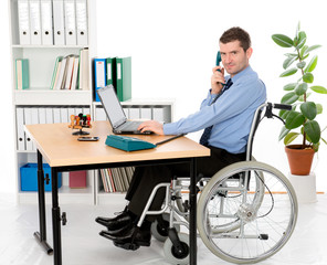 man in wheelchair is working