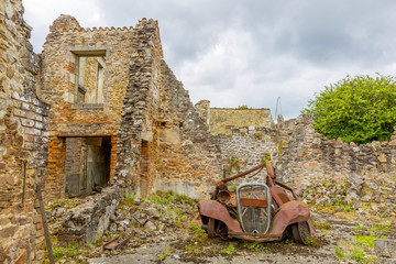 A rusty motorcar in Oradour-sur-Glane