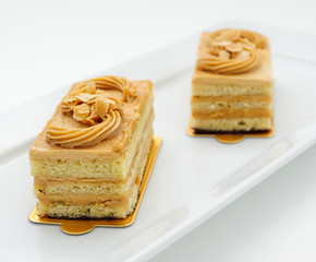 Small sponge cakes on white plate